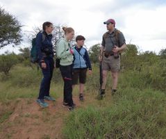 Explaining a termite mound to guests